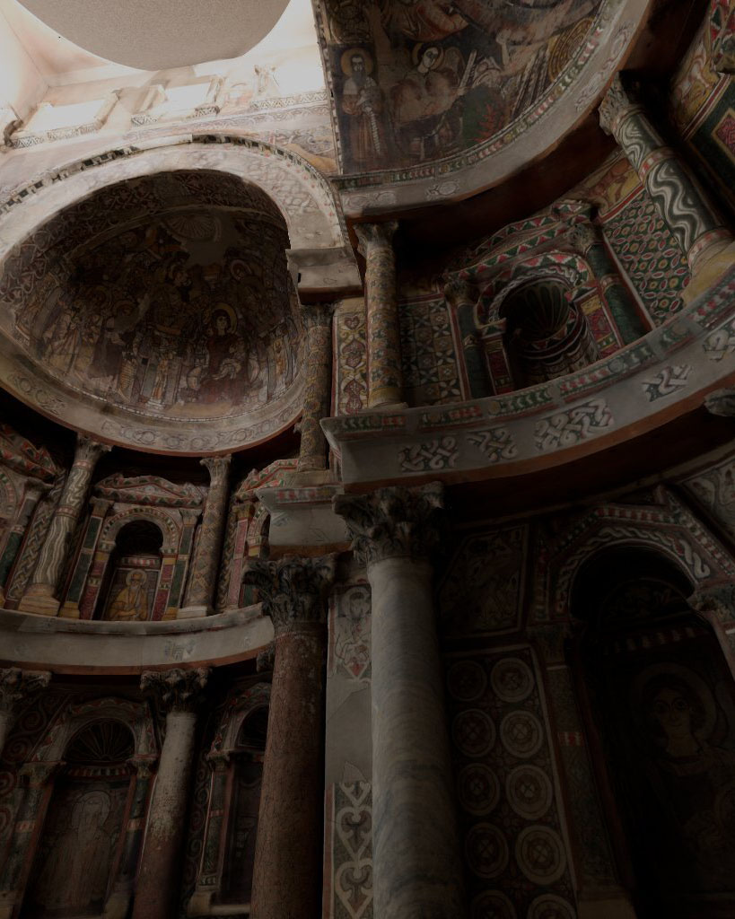 Interior of the Red Monastery with vibrant Byzantine frescoes covering walls and ceiling