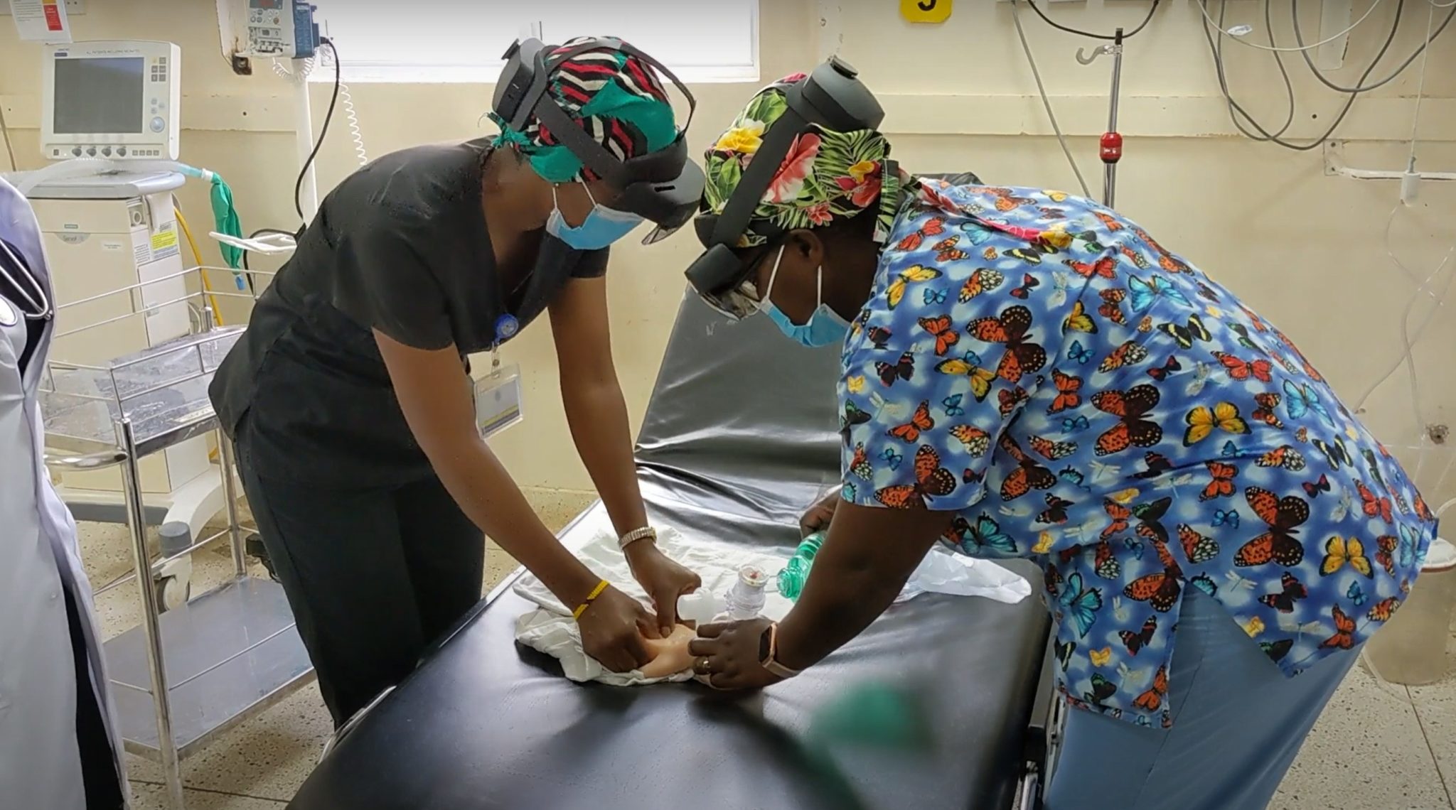 Map showing HoloBaby deployment locations across rural Maine, with expansion arrows pointing to international locations.