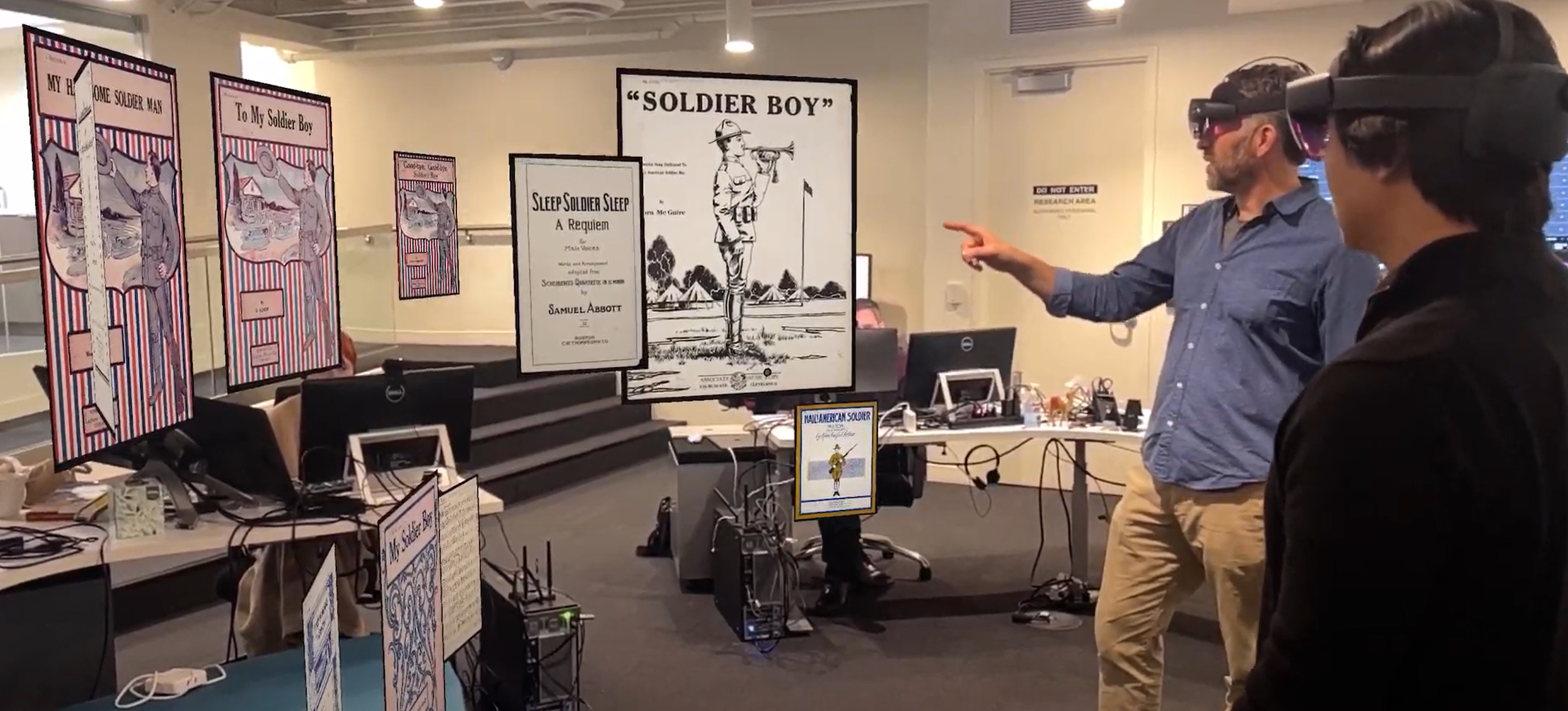 A researcher surrounded by hundreds of music cover art images arranged in 3D space, reaching out to examine one while the broader collection forms patterns behind them.